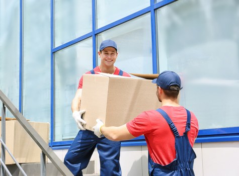 Professional packers handling items in Manandvan West London