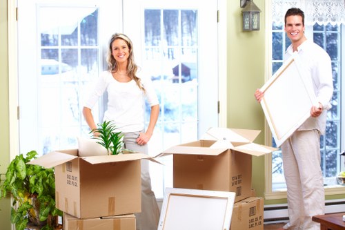 Local removalists unloading items at a new home